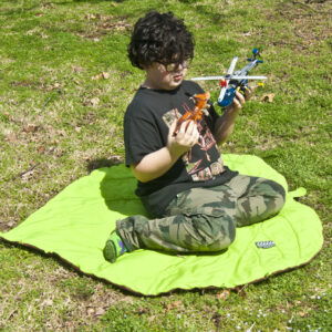 Handmade Kawakawa play blanket with child