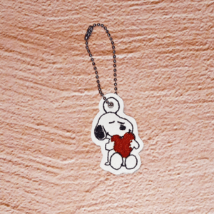 Sitting Beagle Hugging A Heart Bag Dangle