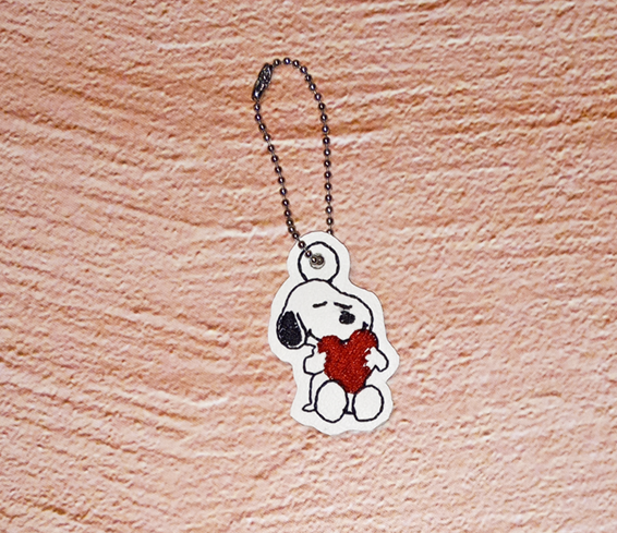 Sitting Beagle Hugging A Heart Bag Dangle