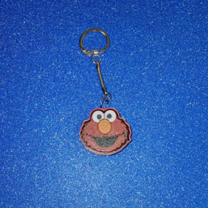 Happy Little Red Monster Clicker Keychain