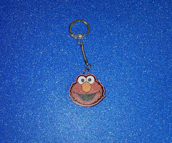 Happy Little Red Monster Clicker Keychain